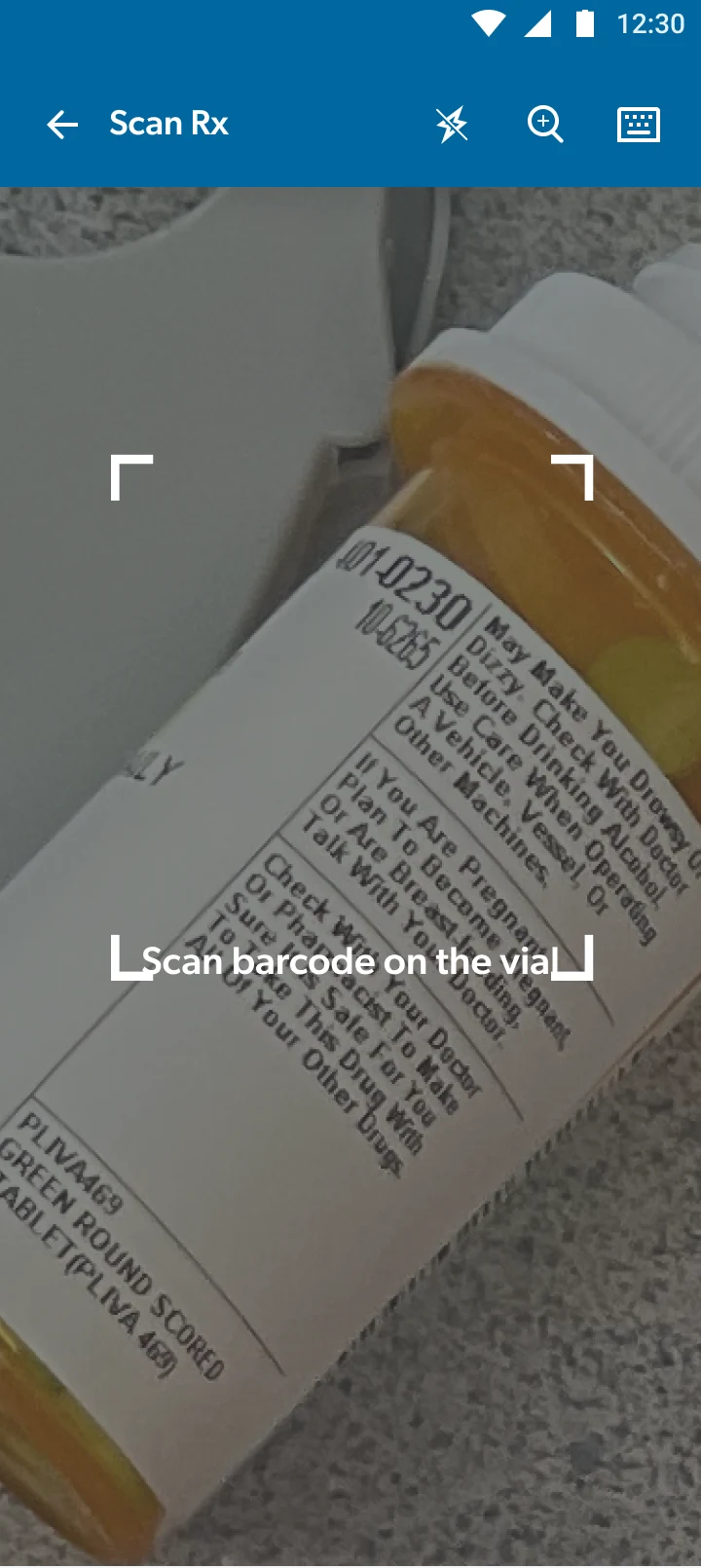 Barcode scanner framing a prescription vial